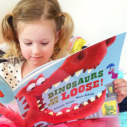 Child reading a picture book